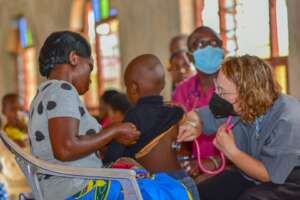 A medtreks nurse listening for breath sounds