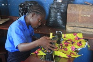 A student using the new sewing machine