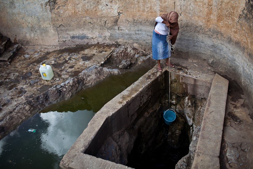 Victoria drawing water at the well