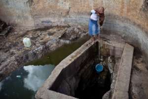 Victoria drawing water at the well