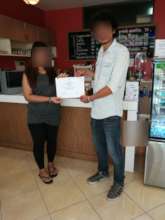 Woman receive cooking certificate