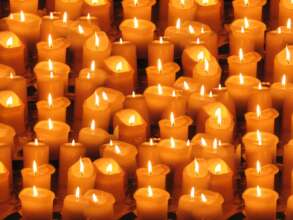 Lighting candles for those who suffer.