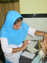 Checking the eyes of a patient