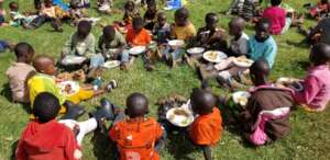 Children sharing food in the slopes of Mt. Elgon