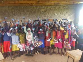 Girls displaying their sanitary napkins.