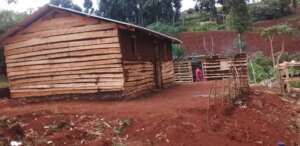 A house with a kitchen made of wood and mud