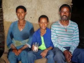 Alemnesh with her husband and of their children