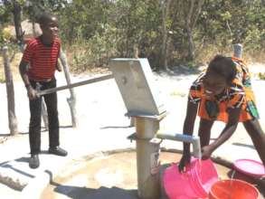 Brian pumps water for his older sister