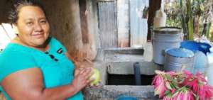 Felicita showing her future water source at home
