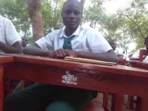 Amahoro Secondary Student at new Proj Wezesha desk