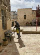 Disinfecting the courtyard at SCC