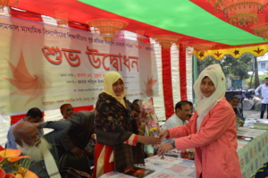 Handing flowers to guests during publication event