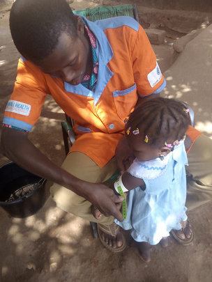 CHW taking a brachial measurement