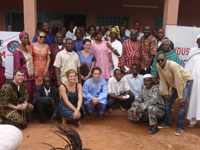 The MHOP team gathers in front of the new clinic