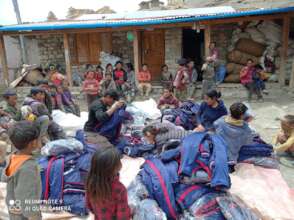 Unpacking a donation of school uniforms