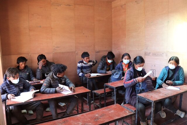 Older students in bright new classroom