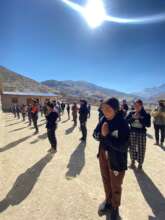 Morning prayers in school courtyard