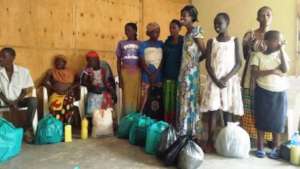 HIV+ people receiving food from Red Cross