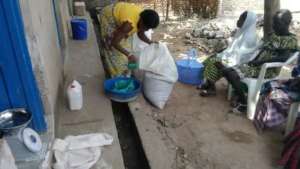 Distribution of Red Cross food to HIV+ women.