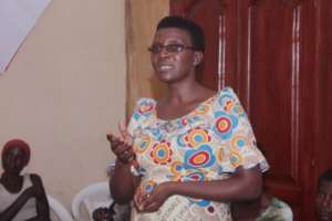 Parfaite welcomes HIV+ beneficiaries to clinic.