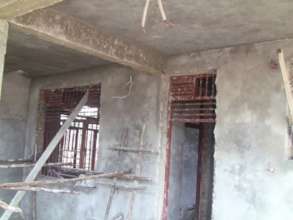 Plastering of inside walls of maternity ward.