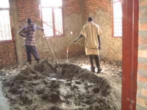 Plastering of inside walls of maternity ward.