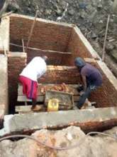 Building the septic tank for the maternity ward.
