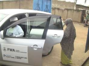 Benita being driven to Gitega Regional Hospital.