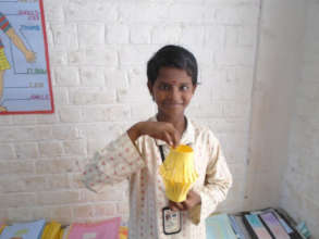 A girl student in an Arts and Crafts class