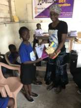Speller receiving her prize