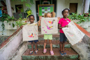 Showing off bird totes.