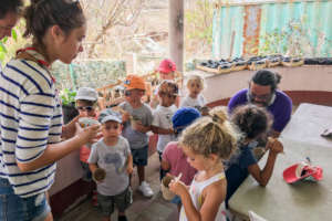 Planting seeds with a school group.