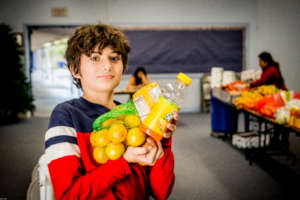 Child with oranges