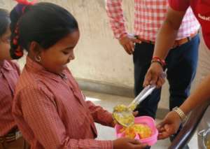 Indu being served the mid-day meal