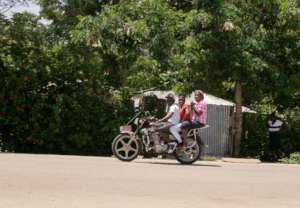 Maudeline on boyfriend's motorbike