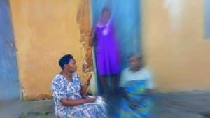 Teacher Lydia supports a student & her grandmother