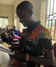 young person reads from their notes to the group