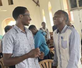 young people laugh together during group activity