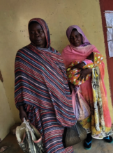 Mothers receive food for their children