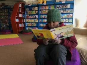 Students Reading A Bhoti Story Book