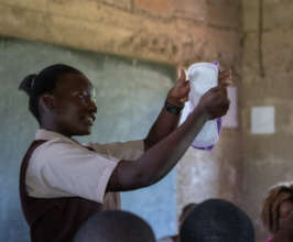 A girl explaining how to use menstrual products.