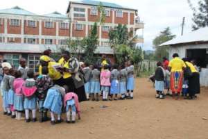 Mothers talking to students during a group session