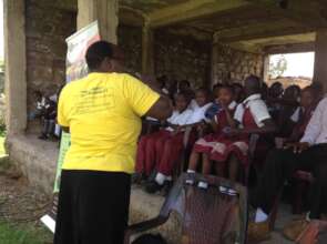 Gladys explain the health impact of FGM to pupils