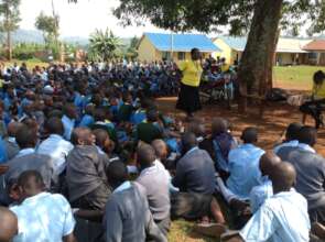 Gladys guiding learners on FGM awareness.