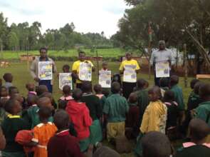 HFAW distributing the Anti-FGM messaging posters.