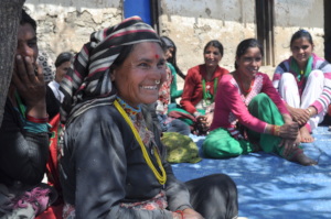 A woman smiles during a Women's Circle in Sipkhana