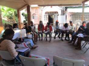 Girls' group mentors gather for a training.