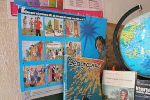 A 'Power To Girls' poster in use in a classroom.