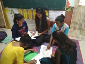 Shabnam teaching her siblings.