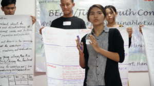 Su presenting at a youth conference